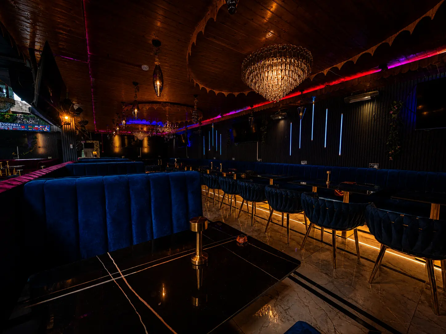Blue velvet booths and marble tables